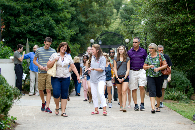 Students and parents walking together on campus
